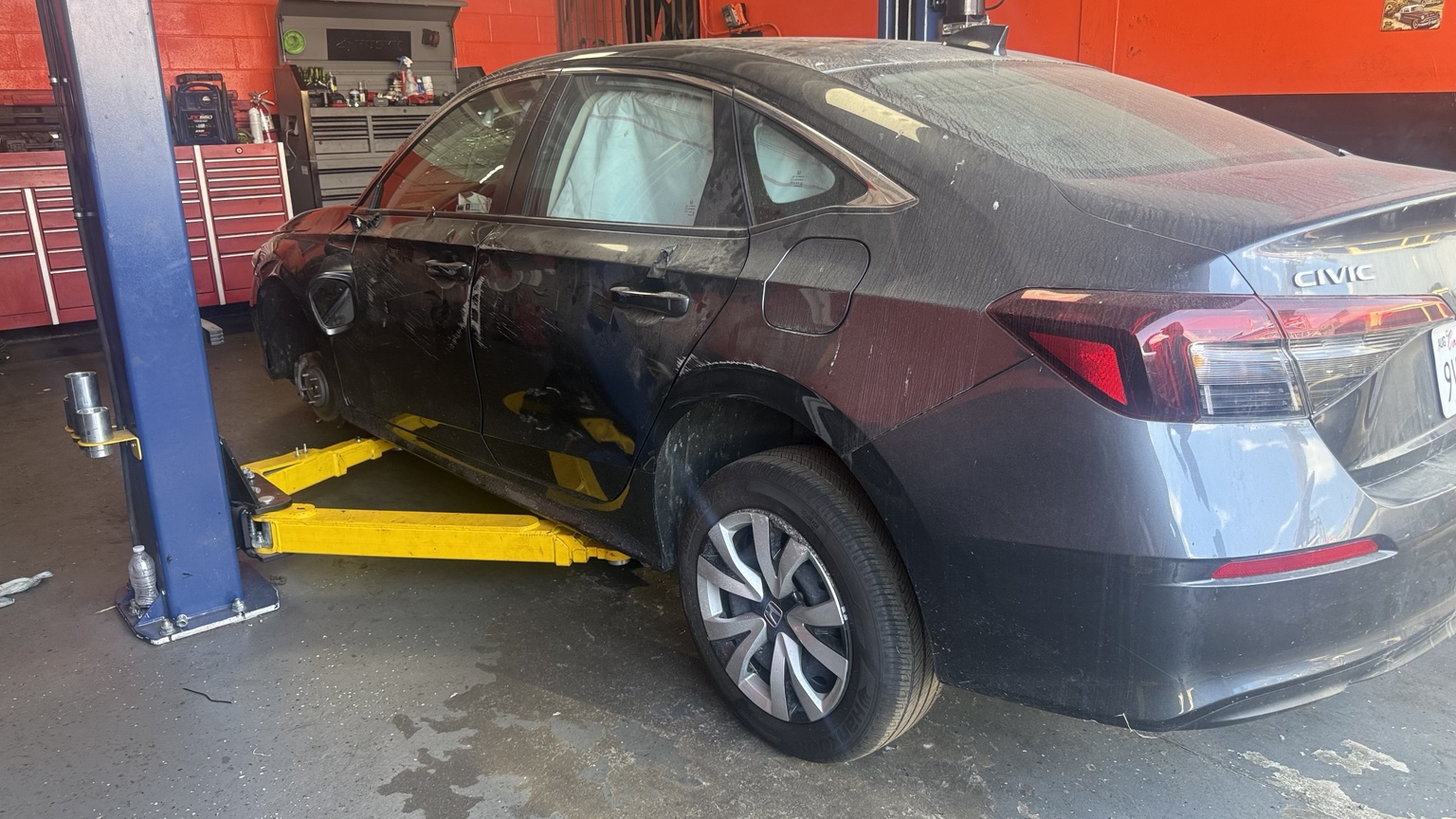 Vehicle being serviced at Broadway Tires & Auto